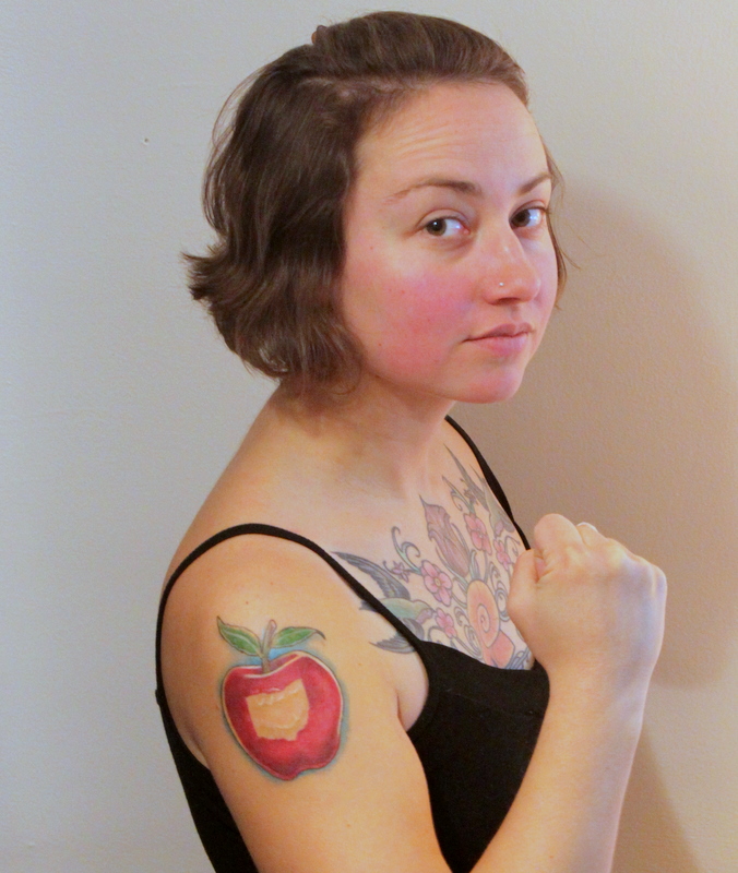 bitten-apple-fruit-tattoo-on-shoulder